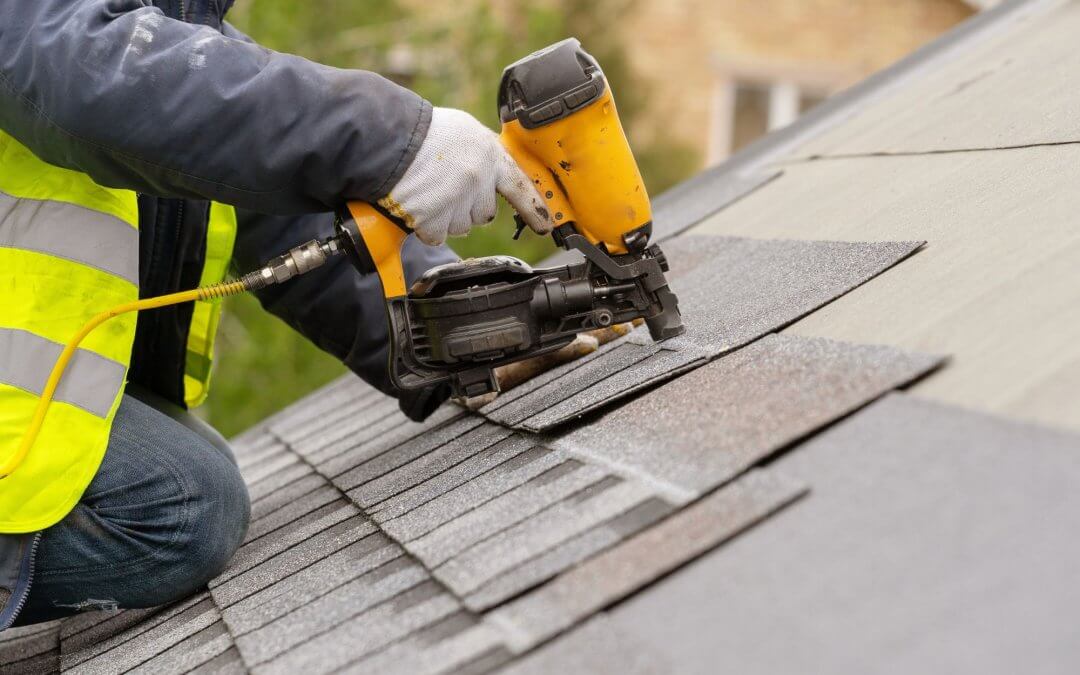 Photo of man repairing roof panels