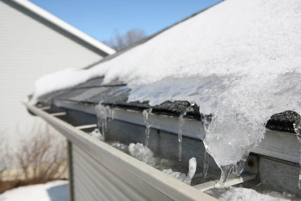 closeup of roof covered with a layer of snow