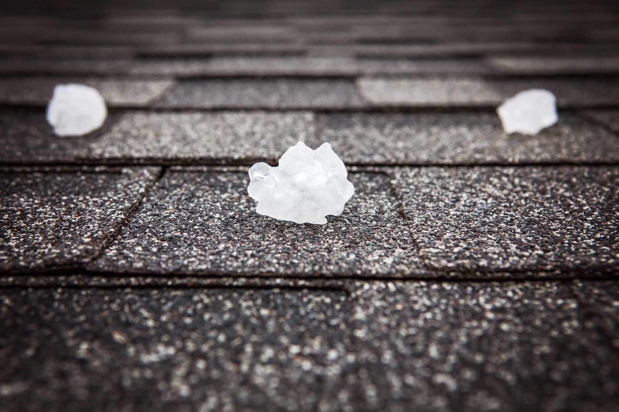 Hail on a shingle roof after a storm
