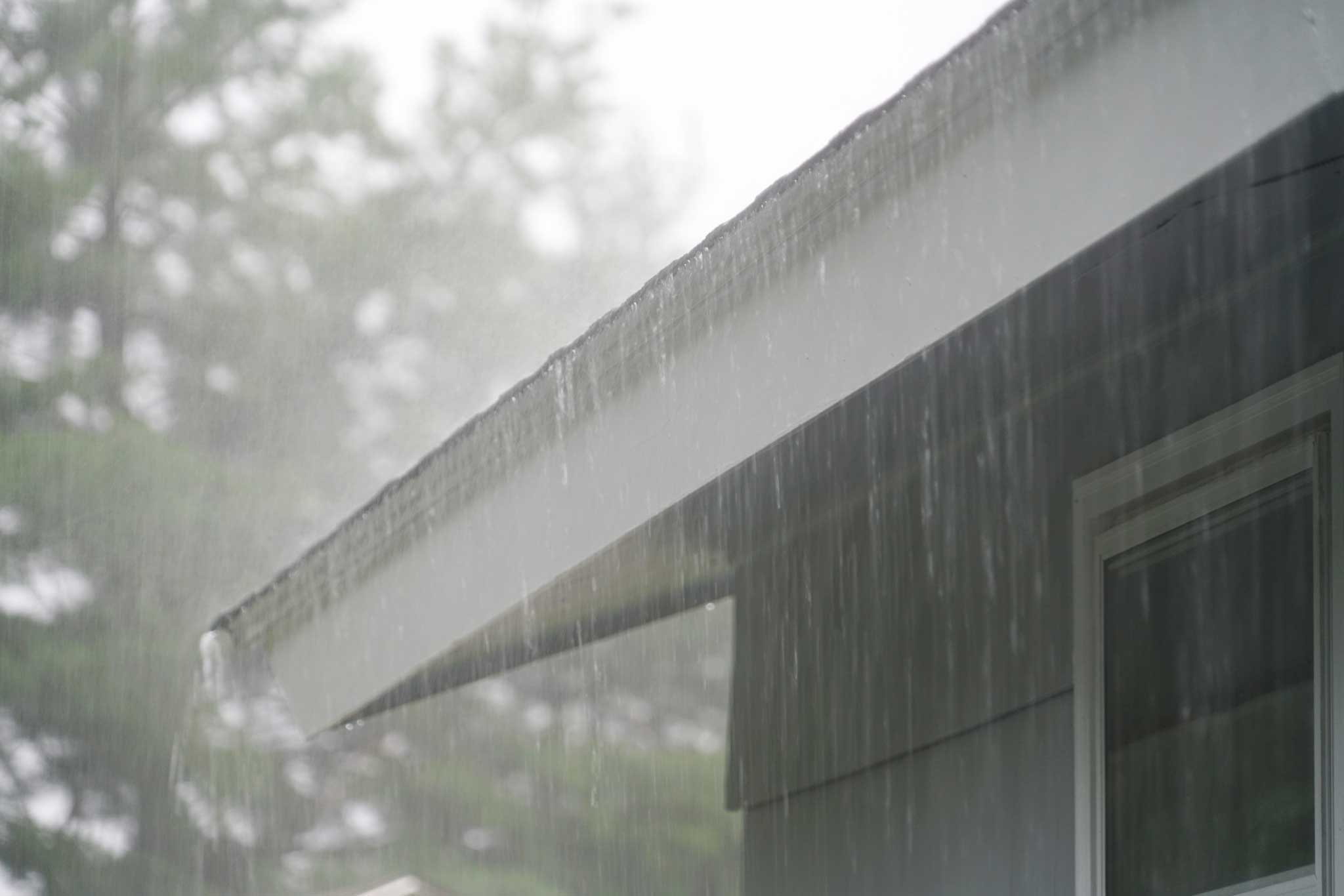 rain falling off of roof